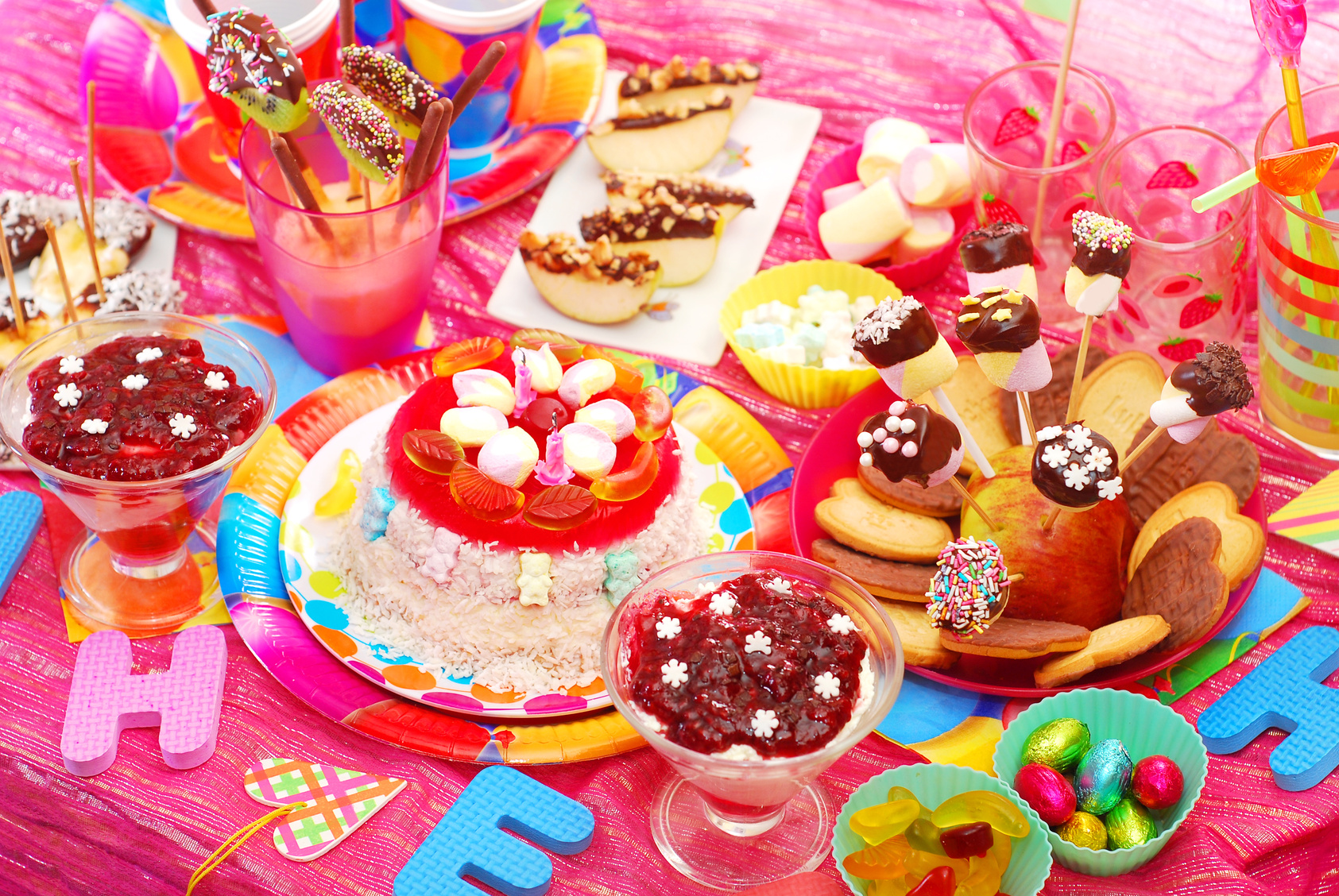 birthday party with homemade torte and fruit sweets for children