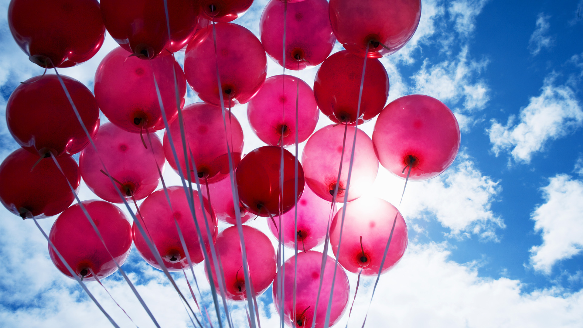 Red balloons against blue sky --- Image by © Karan Kapoor/cultura/Corbis